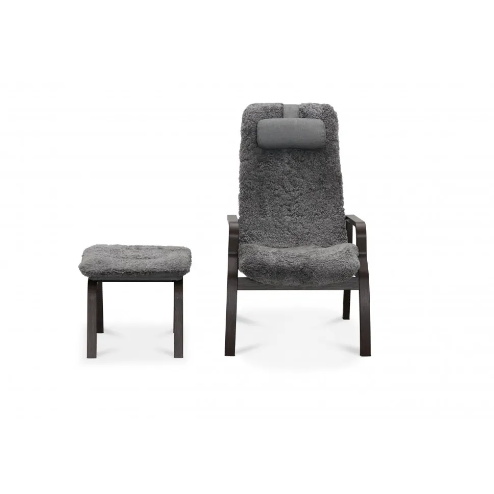Fårskinnsfåtölj med fotpall - Frank + Möbeltassar