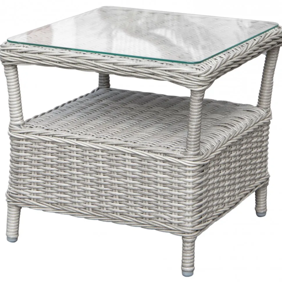 Fåtöljset med fotpallar och sidobord