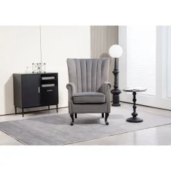 Öronlappsfåtölj i grått sammet